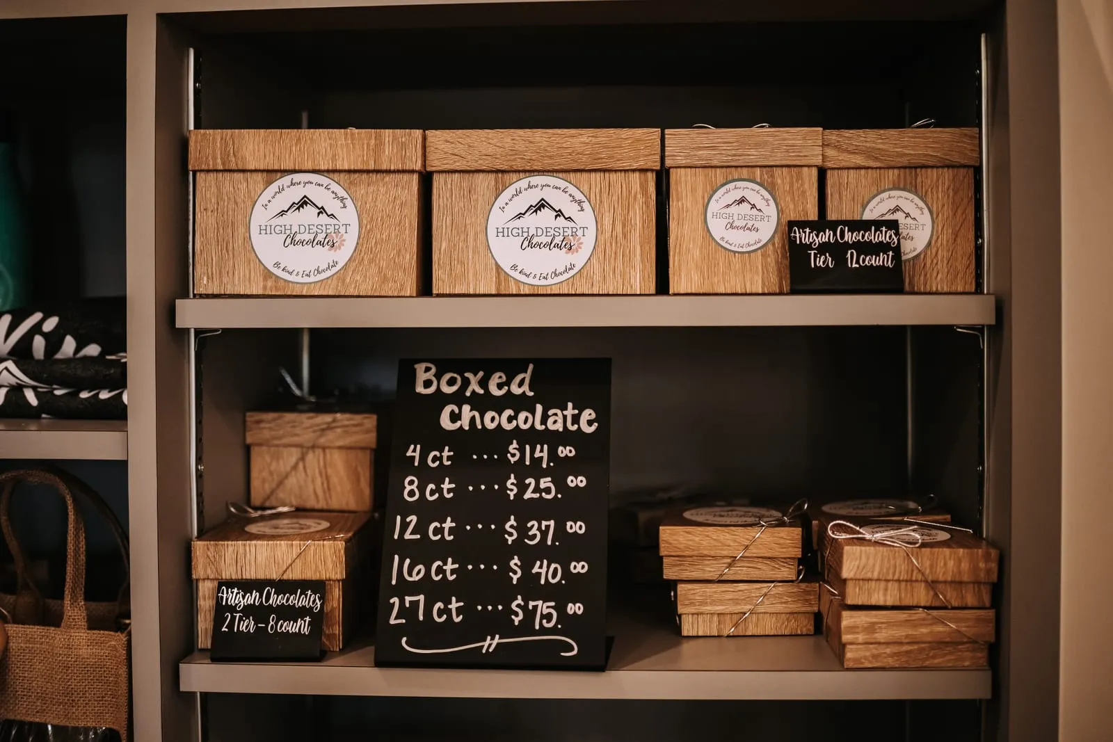 A shelf of boxed artisan chocolate assortments ready to gift
