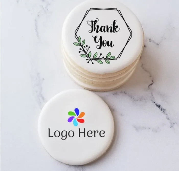 Stacked Thank You sugar cookies beside a demo cookie marked Logo Here