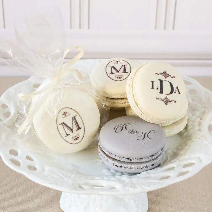 Macarons stamped with custom monograms in clear cellophane bags